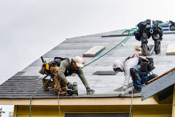 Professional Roofing technician working in Tilghman, MD